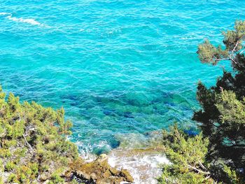 High angle view of rocks by sea