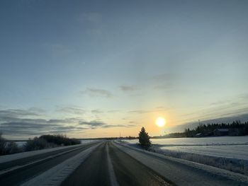 Road against sky during winter