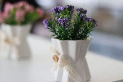 Close-up of white flower vase on table