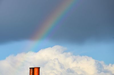 Low angle view of rainbow against sky