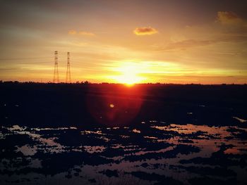 Scenic view of silhouette landscape against sky during sunset