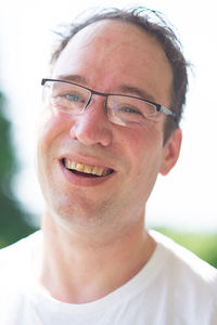 Close-up portrait of smiling young man