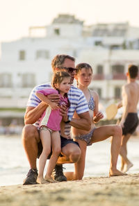 Young couple sitting on beach