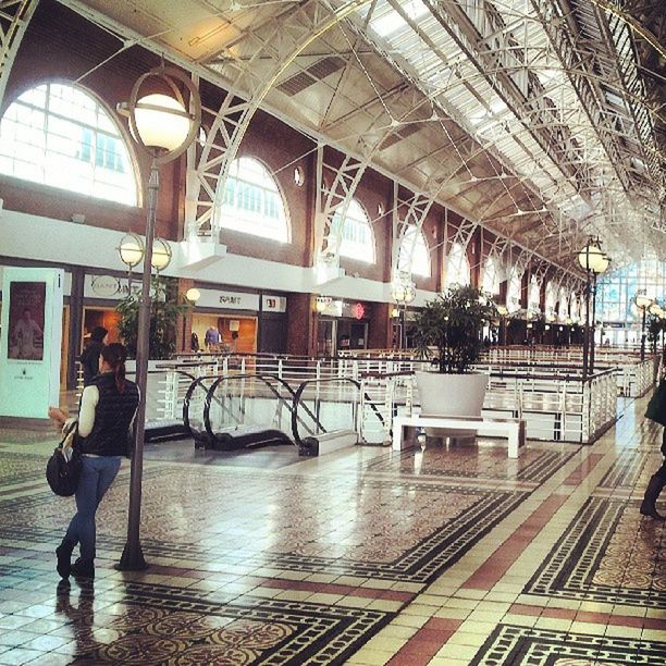 architecture, built structure, indoors, building exterior, window, sunlight, transportation, day, flooring, reflection, incidental people, empty, ceiling, tiled floor, men, chair, building, water, architectural column