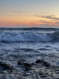 Scenic view of sea against sky during sunset