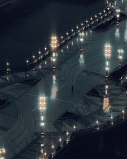 High angle view of illuminated street lights at night