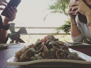 Midsection of people having food
