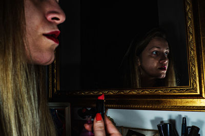 Portrait of young woman looking at camera