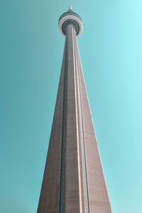 Very high modern concrete tower in a blue sky in daylight. architecture concept.