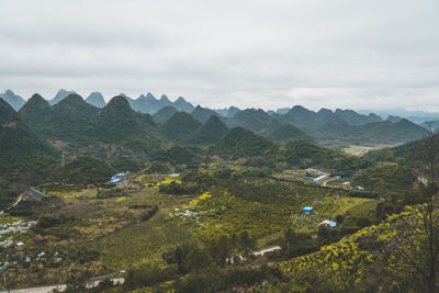 High angle view of trees and mountains against sky