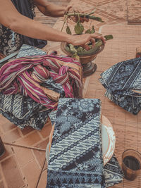 Midsection of woman working in workshop