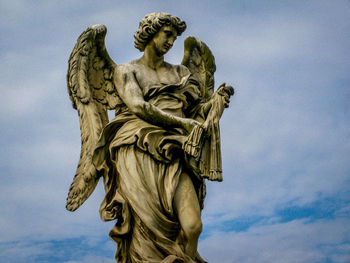 Low angle view of statue against sky