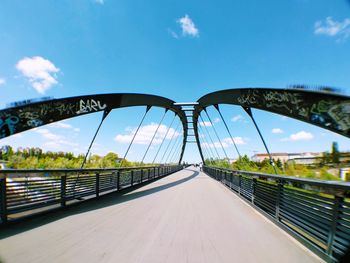 Footbridge over river in city