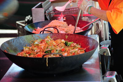 Midsection of man preparing food