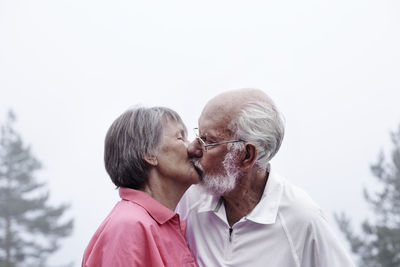 Senior couple kissing