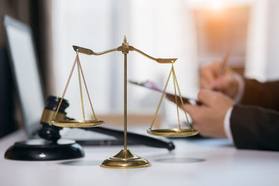 Close-up of hand on table