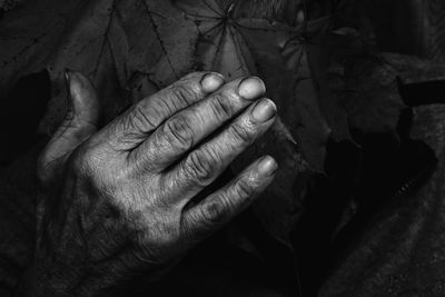 Close-up of man holding hands