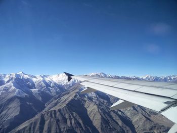 View of snow covered landscape from airplane