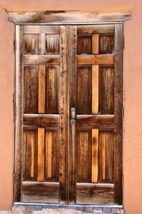 Close-up of closed wooden door of building