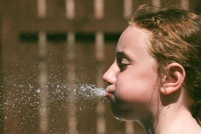 Portrait of teenage girl in water
