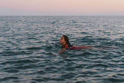 Man swimming in sea