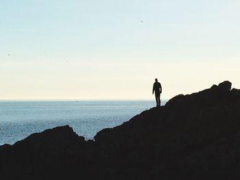 Man standing on cliff