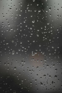 Full frame shot of wet glass window