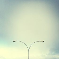 Low angle view of street light against sky