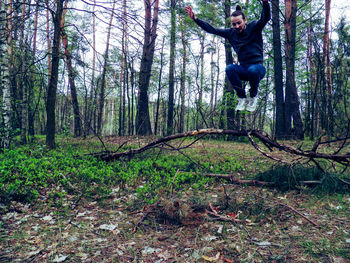 Boy playing in forest