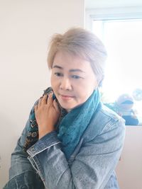 Portrait of smiling woman at home