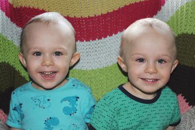 Portrait of cute twin boys smiling