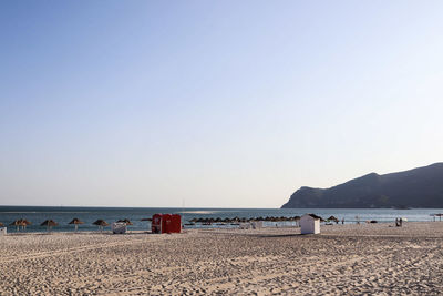 Scenic view of beach against clear sky