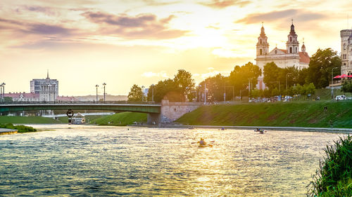 View of bridge over river with city in background