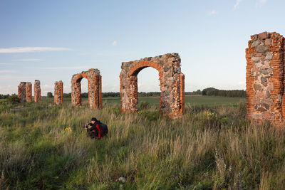 Old ruin on field against sky