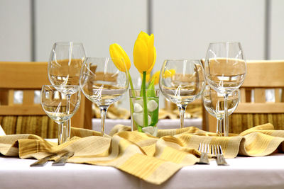 View of wineglasses with flower on table