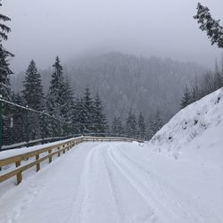 Scenic view of snow covered mountains against sky