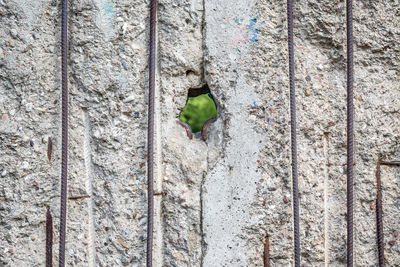 Full frame shot of historic berlin wall with hole