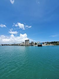 Scenic view of sea against blue sky