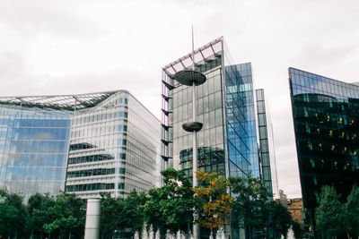 Low angle view of modern buildings against sky