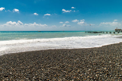 View of beach against cloudy sky