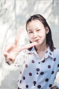 Portrait of smiling girl standing outdoors