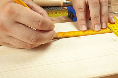 Close-up of man on table