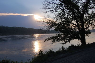Scenic view of lake at sunset