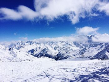 Scenic view of snowcapped mountains against sky