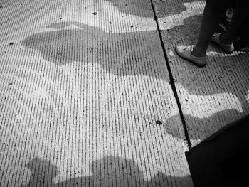 Low section of man standing on floor