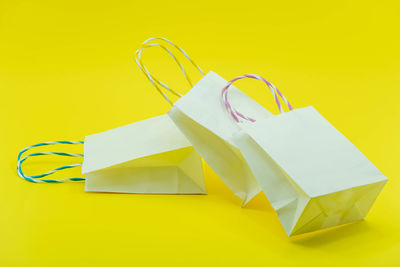 Close-up of yellow paper over white background