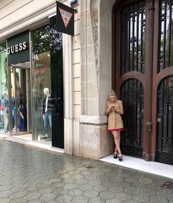 Woman walking on footpath