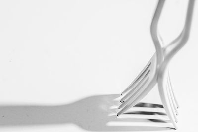 Close-up of forks against white background