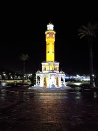 Illuminated building against sky at night