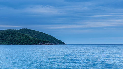 Scenic view of sea against blue sky